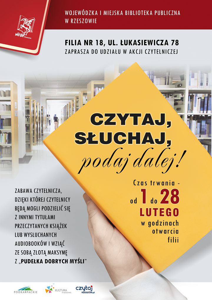 Żółta książka na tle regałów bibliotecznych.