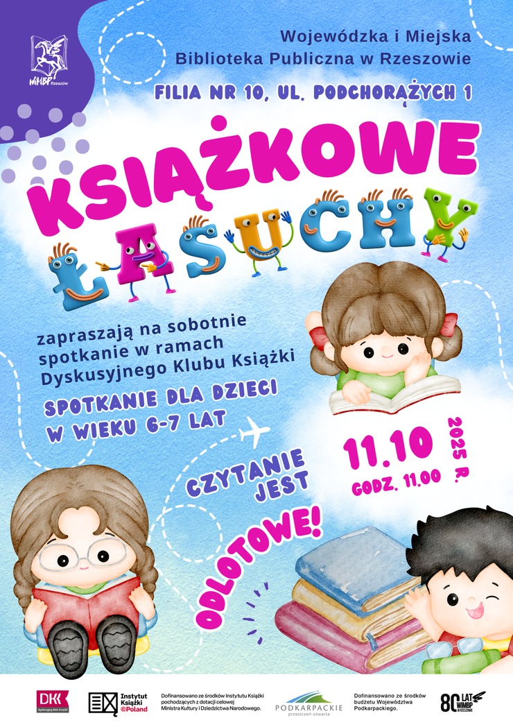 Napis łasuchy z uśmiechniętymi literkami, obok czytające dzieci