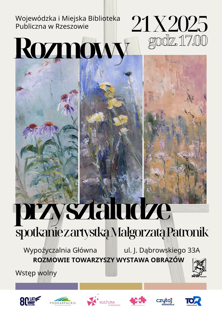Na sztaludze trzy obrazy przedstawiające kwiaty