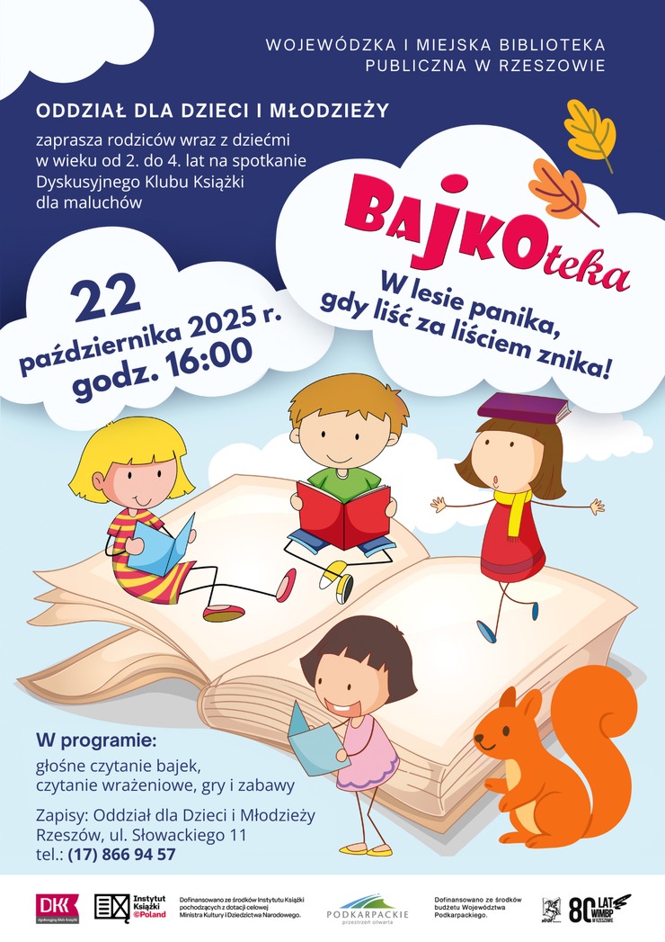 Czwórka dzieci siedzących na książce.