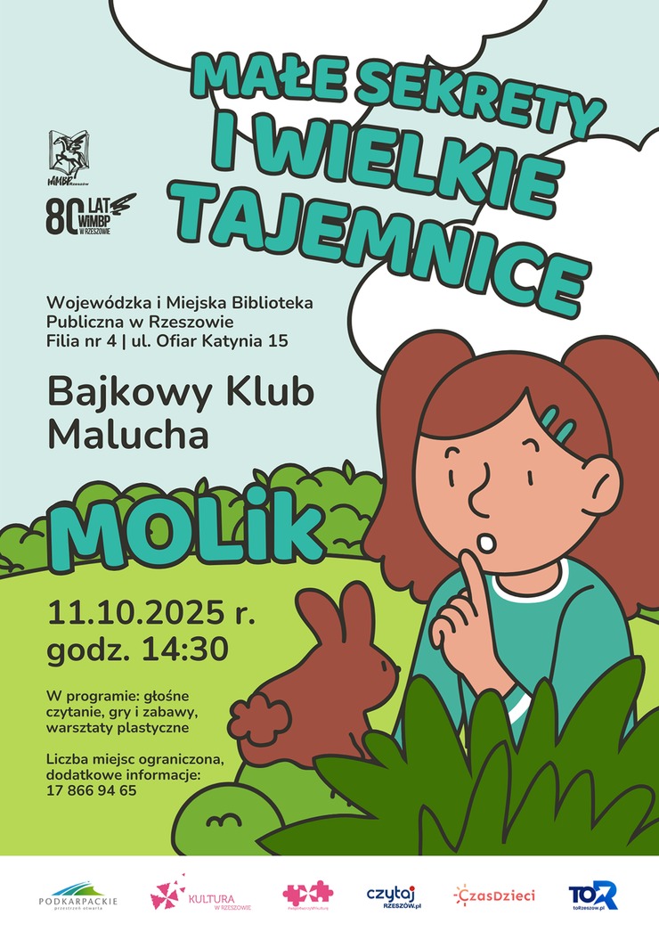 Dziewczynka i królik wśród zieleni.